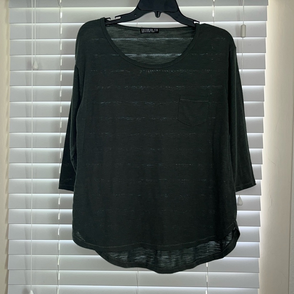 Green half sleeve t-shirt with pocket.